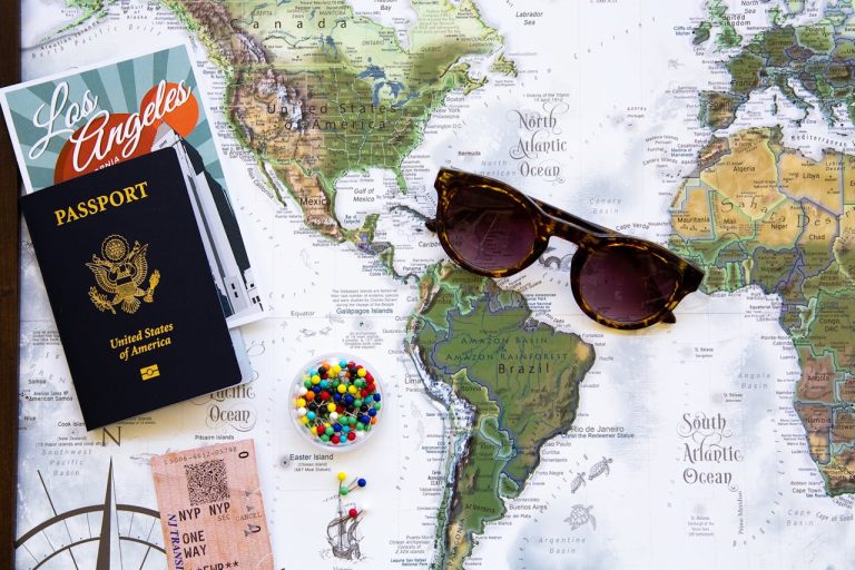 World map with sunglasses and a US passport